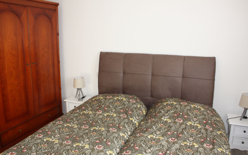 Photo du lit de la chambre de l'appartement duo